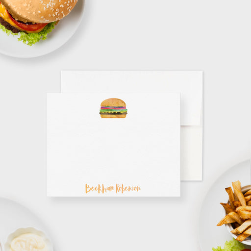 Personalized note card with a watercolor cheeseburger illustration and a personalized name, shown with a white envelope.