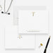Personalized caduceus note cards with a printed gold medical symbol and name, shown with white envelopes-front-back