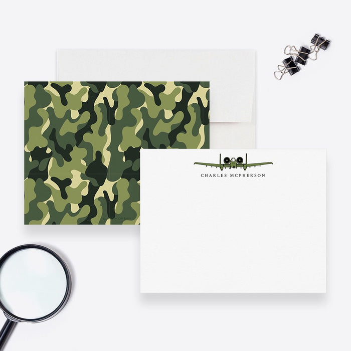Personalized camo note cards with an aircraft and name on the white front and a green camouflage pattern on the back.