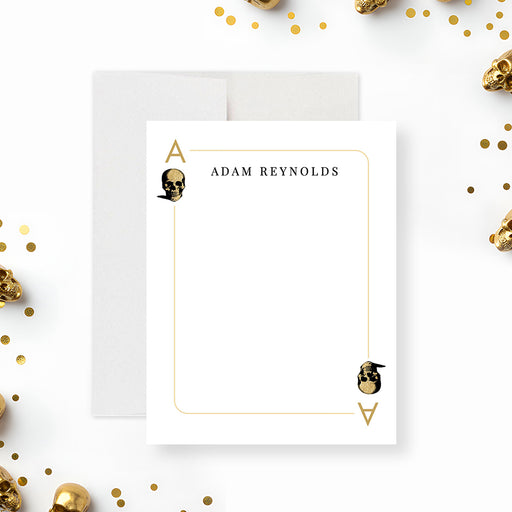Front and back of a personalized casino note card with custom name, ace playing card border and black and gold skull pattern-front