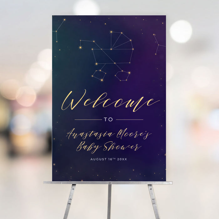 Personalized celestial baby shower welcome sign on an easel with a stroller constellation against a navy and purple starry sky