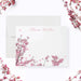 Personalized note card with a white front with pink cherry blossom branches and a personalized script name. Shown with a white envelope.