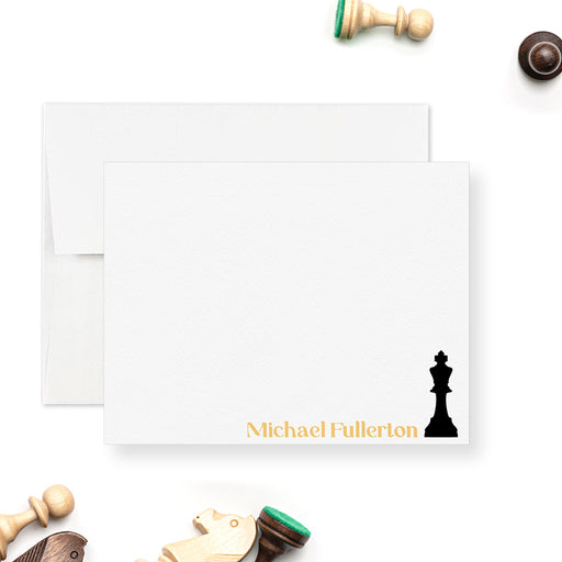 Personalized chess note card with a black king and a printed gold name at the bottom of a white front.