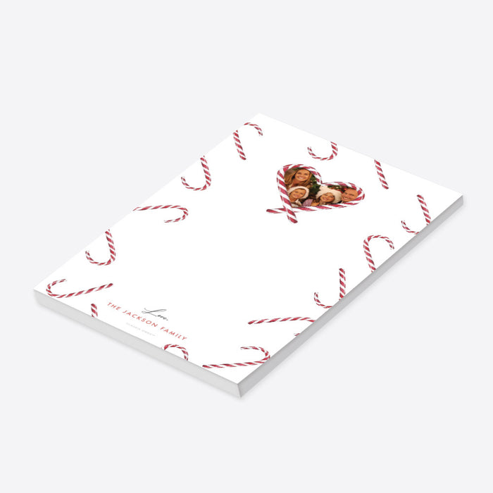 Personalized Christmas notepad with candy cane pattern, heart-shaped family photo, and custom family name-side