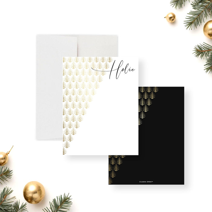 Personalized Christmas note cards with a printed gold pine pattern on the white writing front and a matching pattern on the black reverse.