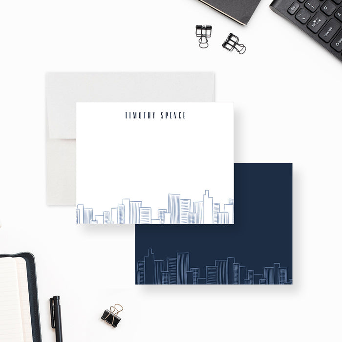 Personalized City Skyline Note Cards. Front and matching navy back with matching city skyline line art displayed with a white envelope.