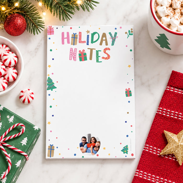 personalized Christmas photo notepad with colorful Holiday Notes lettering, festive gift and tree icons, and custom photo