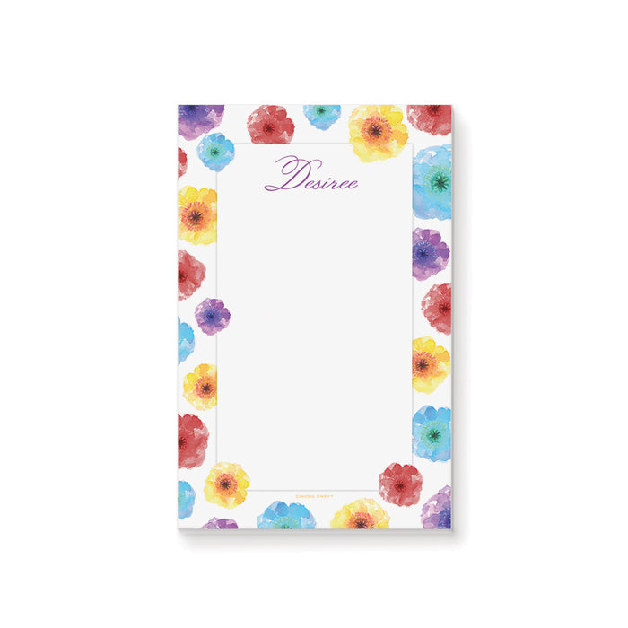 personalized colorful floral notepad with watercolor flower border, custom name in script lettering, and blank writing space