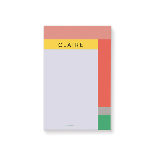 Personalized geometric notepad with a name, soft lavender writing area, and coral, yellow, blush, gray, and green color blocks