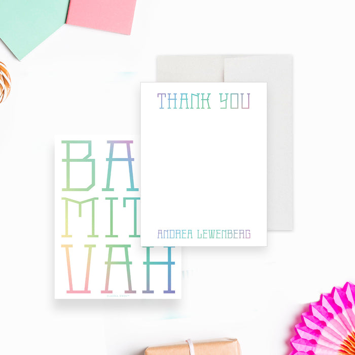 White personalized mitzvah thank you note card with pastel lettering, beside a back with large multicolored Bat Mitzvah typography.