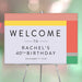 Personalized colorful 40th birthday party welcome sign with custom name, event date and modern coral, yellow, green and lavender blocks