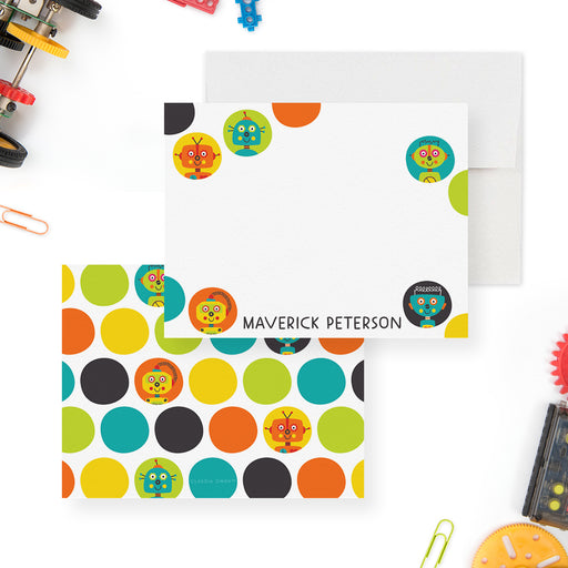 White personalized note card bordered with colorful circles and robot faces, beside a matching multicolored robot-patterned back.
