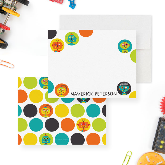 White personalized note card bordered with colorful circles and robot faces, beside a matching multicolored robot-patterned back.