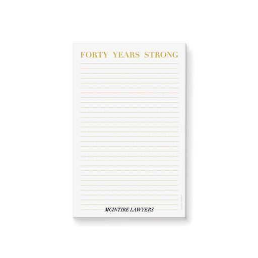 personalized corporate anniversary notepad with Forty Years Strong heading, gold-colored lines, and custom company name