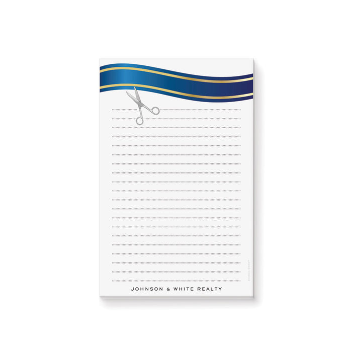 personalized ribbon cutting notepad with blue ribbon design, scissors illustration, lined writing area, and custom business name