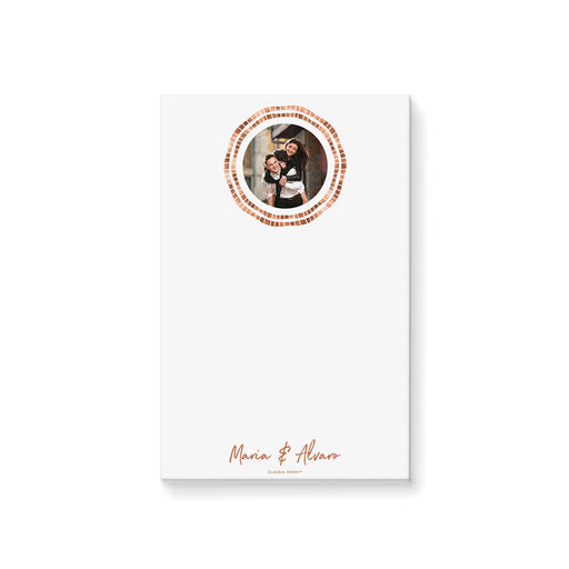 Personalized couple photo notepad with circular photograph, double geometric border in warm copper and peach, names and blank writing space