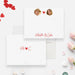 Front and back of personalized note cards with couple portraits, a red heart and personalized names in red script and a red heart and initials design on the back.