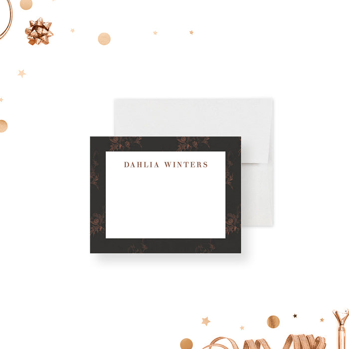 Personalized note card with a white writing area framed by a dark charcoal and warm brown floral border with a personalized name. Shown with a white envelope.