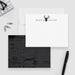 Personalized white note card with a black deer head and antlers and a dark wood grain patterned reverse.