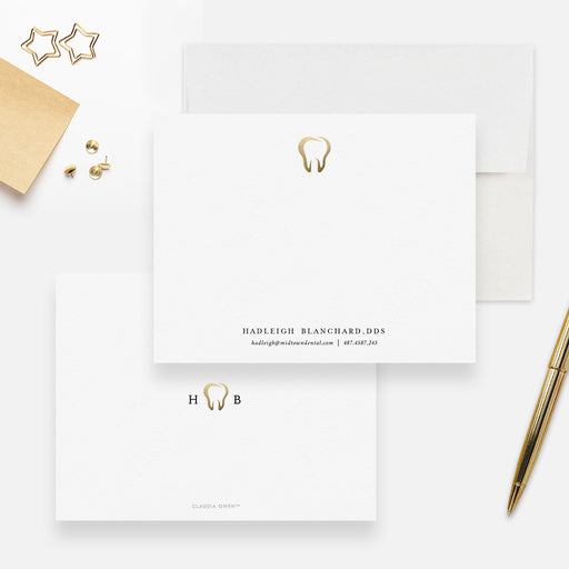 White personalized dentist note card with a small gold-colored tooth, beside the matching white back.