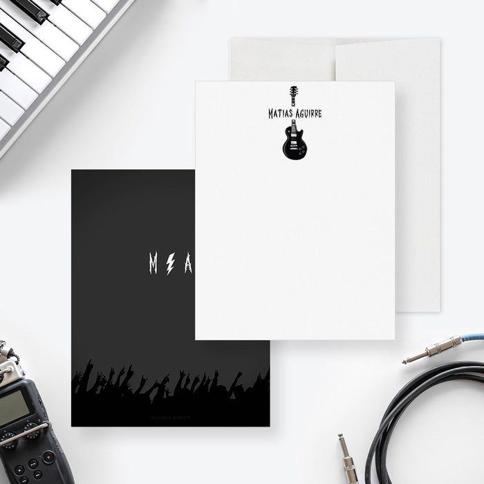 Front and back of personalized note cards with a black electric guitar illustration and a personalized name and a black concert inspired back with initials and a cheering crowd.