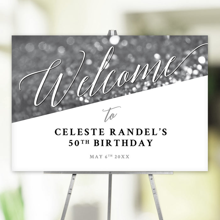 Personalized elegant 50th birthday welcome sign with custom name, celebration date, script lettering and black-and-white bokeh background