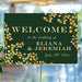Personalized emerald green botanical wedding welcome sign with gold-colored leaf vines, custom couple’s names and wedding date