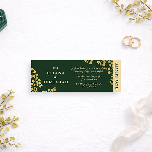 Personalized emerald green wedding ticket invitation with gold-colored leaf vines, couple’s monogram, custom names, event details and vertical Admit One wording