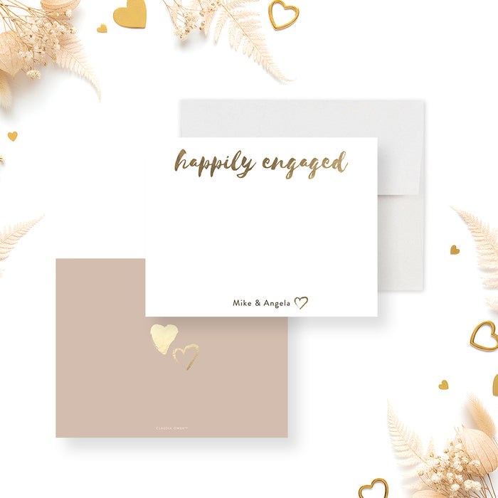 Front and back of personalized engagement note card with Happily Engaged script, couple’s names, beige back and gold heart accents-front-back