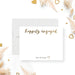 Front and back of personalized engagement note card with Happily Engaged script, couple’s names, beige back and gold heart accents-front