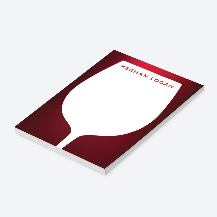 Personalized notepad with a wine glass silhouette on a red background reminiscent of full-bodied wine, featuring a custom name.-side