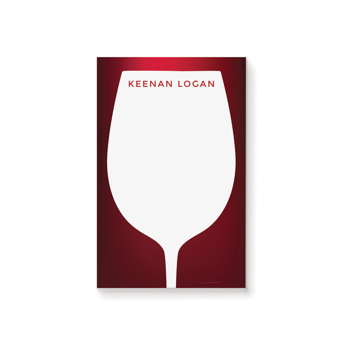 Personalized notepad with a wine glass silhouette on a red background reminiscent of full-bodied wine, featuring a custom name.