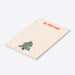 Personalized Christmas notepad with family photos in colorful ornaments on a festive tree-side