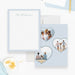 Pale blue family note cards with a white scalloped writing front and three heart-shaped family photos on the back.