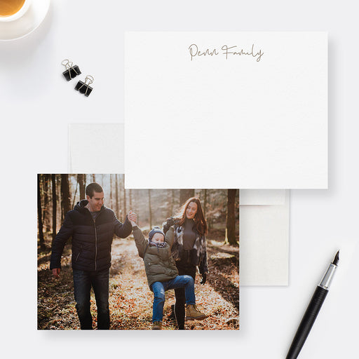 Personalized family note cards with a script family name on the white front and a family photo on the reverse.