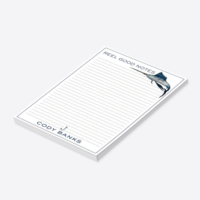 personalized fishing notepad with a blue swordfish illustration, Reel Good Notes design, lined pages, a fishing hook accent, and a custom name-side