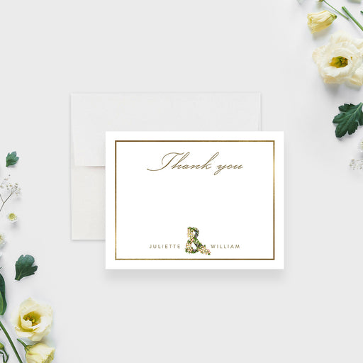 personalized wedding thank you card with floral ampersand, couple names, classic border, and botanical wedding stationery design-front