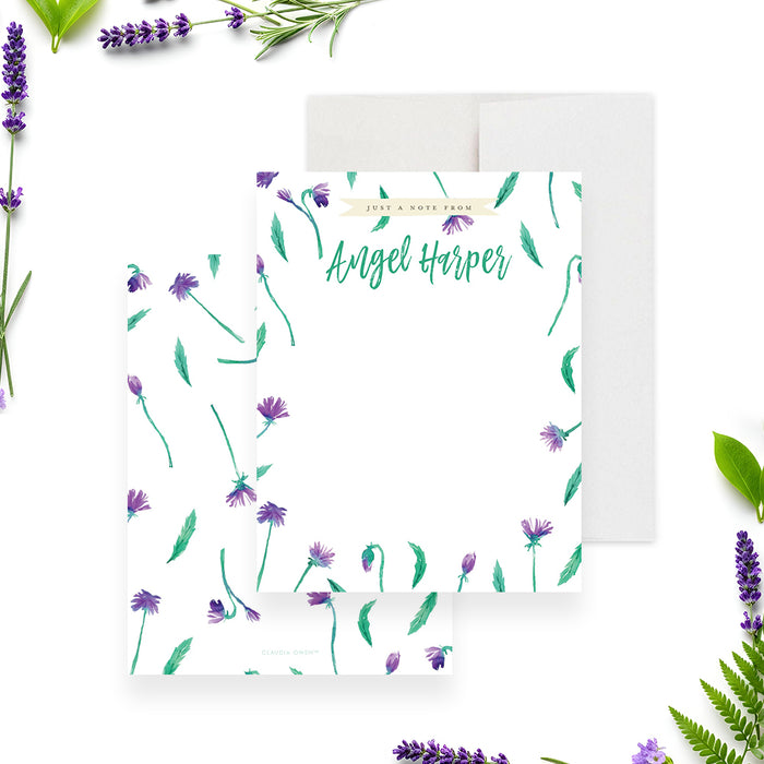 Floral personalized thank you note card with purple flowers, green leaves, and a custom name in vibrant green script-front-back