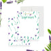 Floral personalized thank you note card with purple flowers, green leaves, and a custom name in vibrant green script-front-back