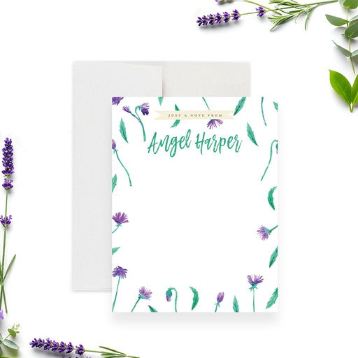 Floral personalized thank you note card with purple flowers, green leaves, and a custom name in vibrant green script-front