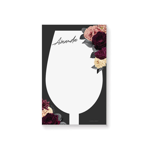 Personalized notepad with a wine glass-shaped writing area, custom name, dark background and burgundy, blush and ivory flowers