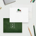 Personalized football note cards with a helmet and ball on the white front and a white monogram on the green grass patterned reverse.
