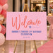 Pink Forever 21 birthday welcome sign with coral script, navy lettering and personalized name and date