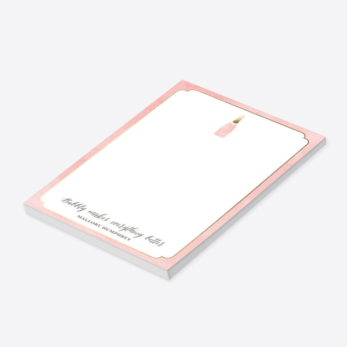 personalized blush pink champagne notepad with champagne bottle illustration, elegant border, custom name, and blank writing space-side