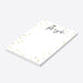 Personalized white notepad with a custom name in black script and elegant gold confetti border on a minimalist stationery design-side
