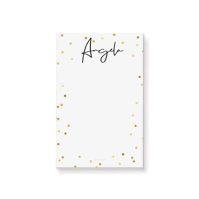 Personalized white notepad with a custom name in black script and elegant gold confetti border on a minimalist stationery design.