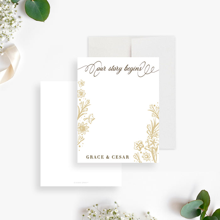 Personalized white and gold floral note card with “Our Story Begins” lettering, blank writing space and custom couple names-front-back