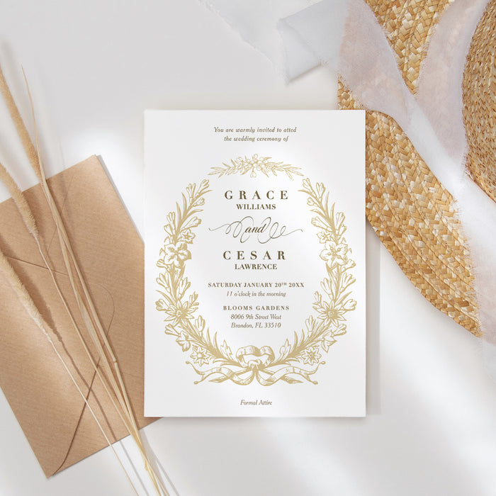 White wedding invitation with a gold floral wreath, botanical leaves, ribbon bow and personalized ceremony details-front