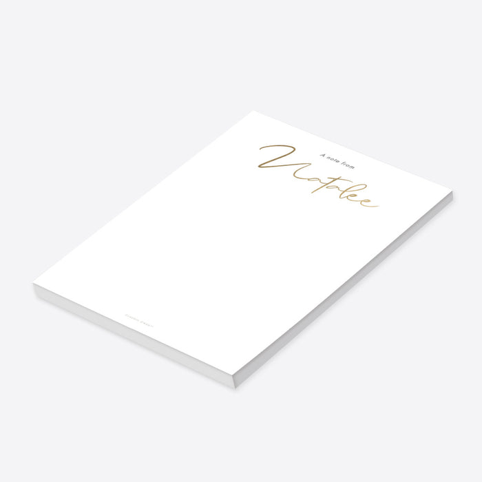 Personalized white notepad with elegant gold script name-side