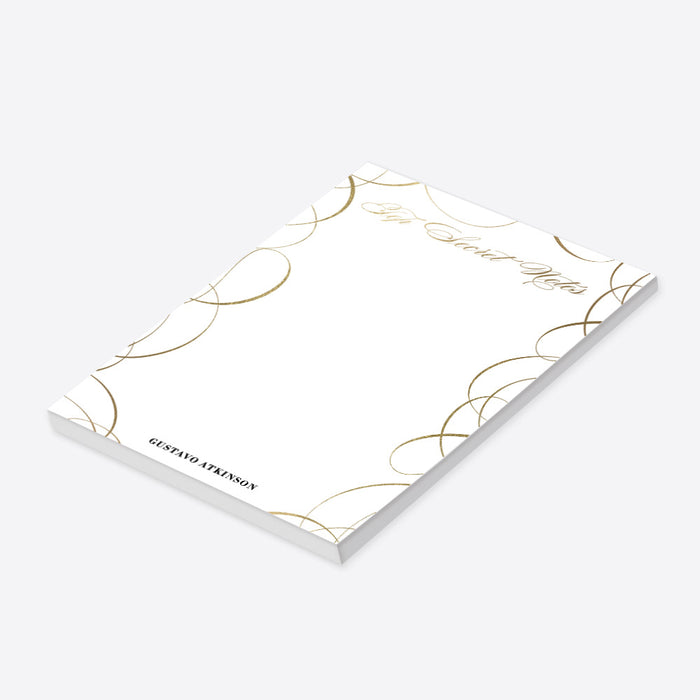 Personalized white notepad with gold swirl borders, elegant Secret Notes lettering, and a custom name at the bottom.